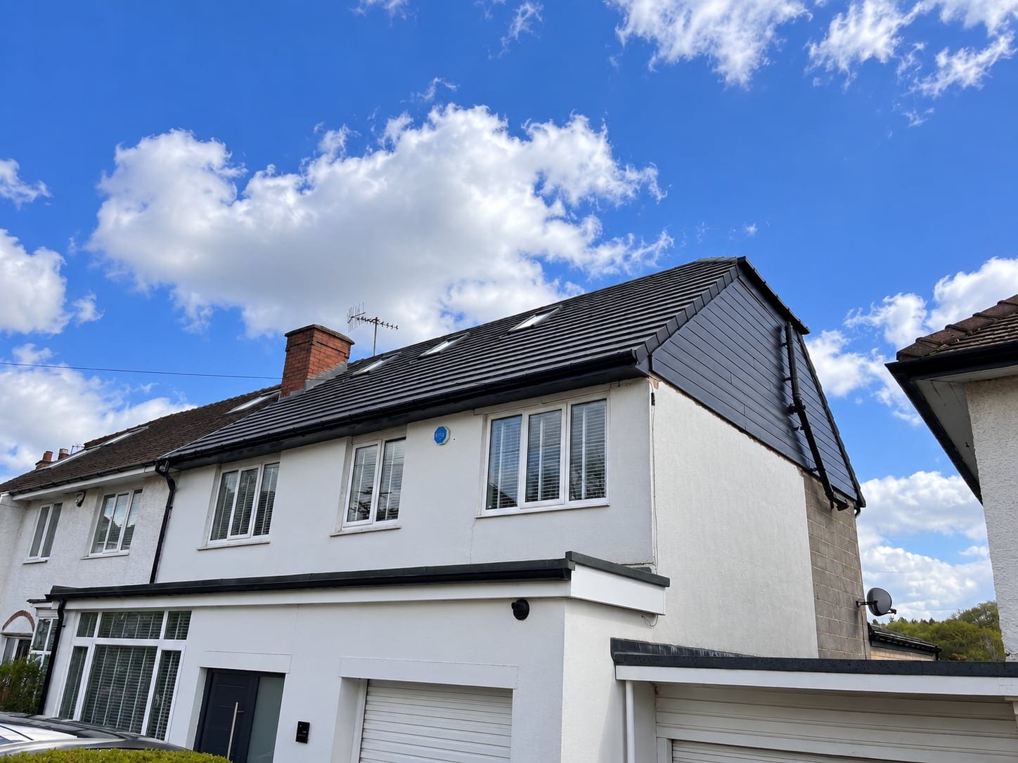 Side of the house under a blue sky