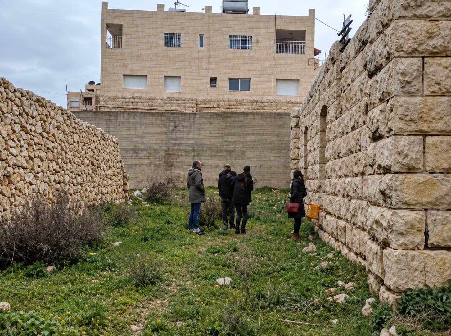 Site visit among the high stone walls of the ruins