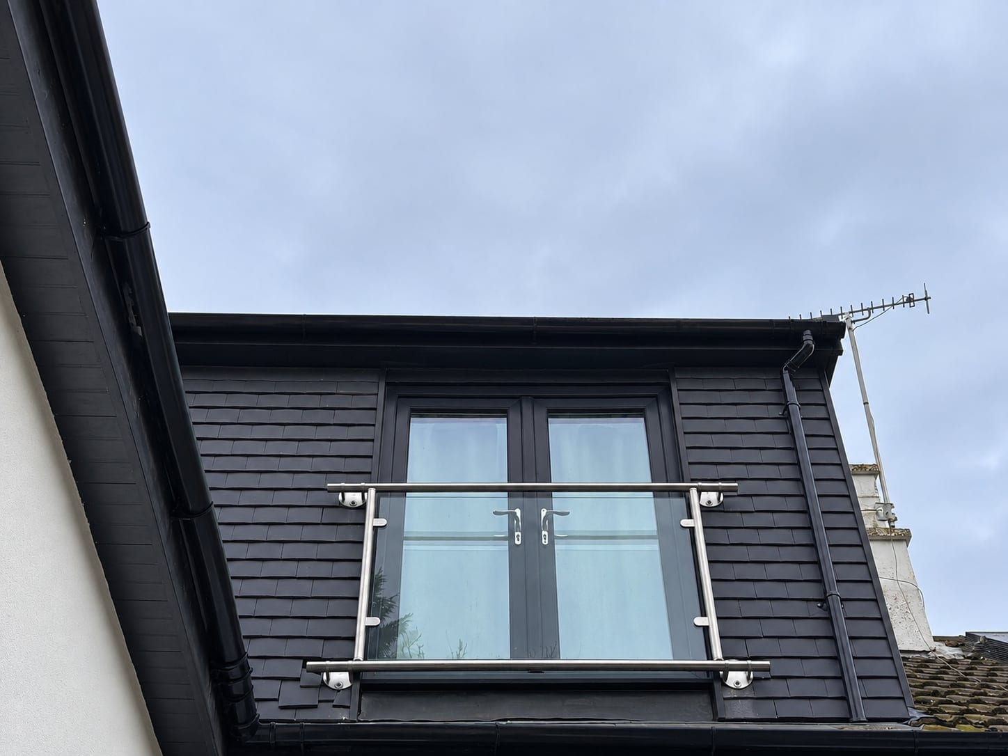 Dark-clad dormer with a glazed Juliet balcony
