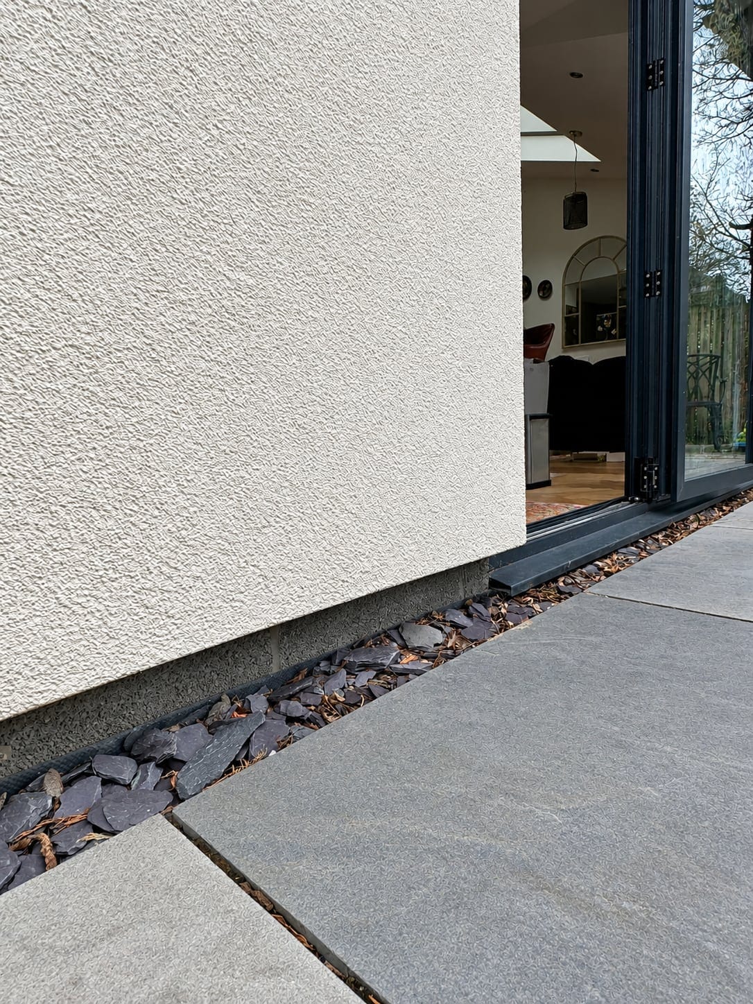Threshold detail where render meets paving