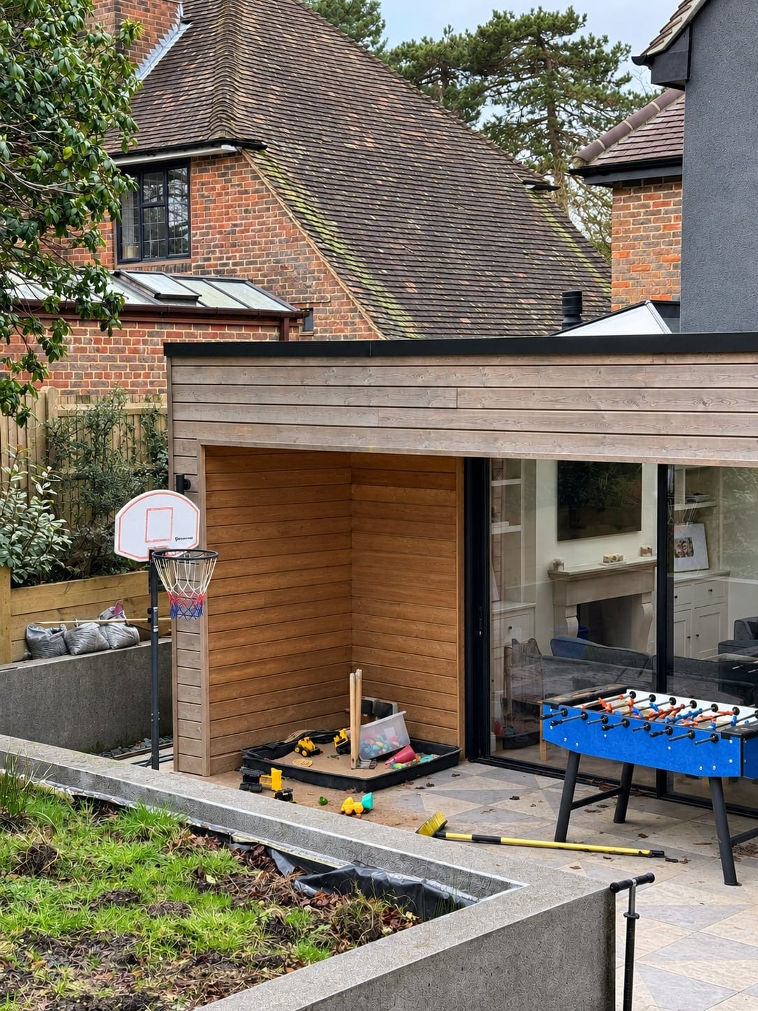 Detail of the timber-clad extension and a sheltered recessed outdoor area
