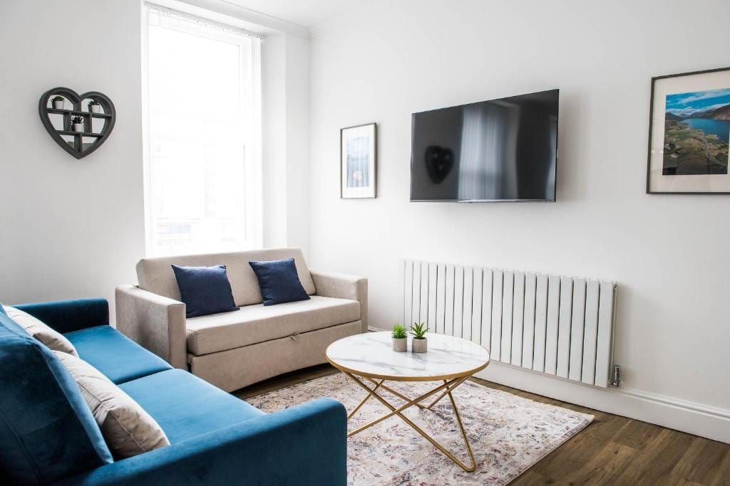 Living room with a sofa and wall-mounted television