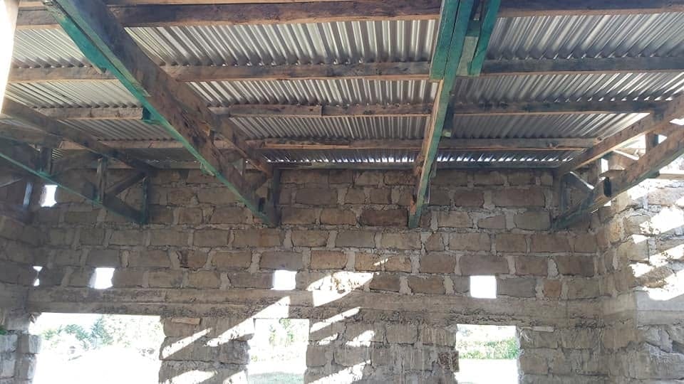 Construction: underside of the timber roof structure and corrugated sheeting