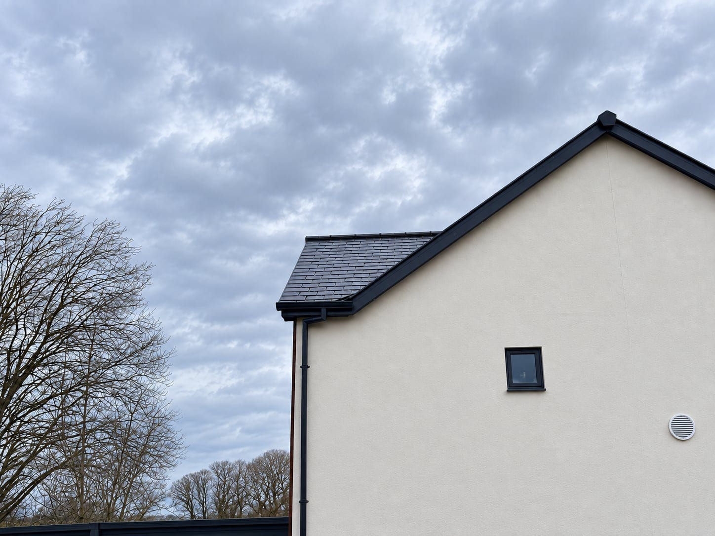 Rendered gable and slate roof