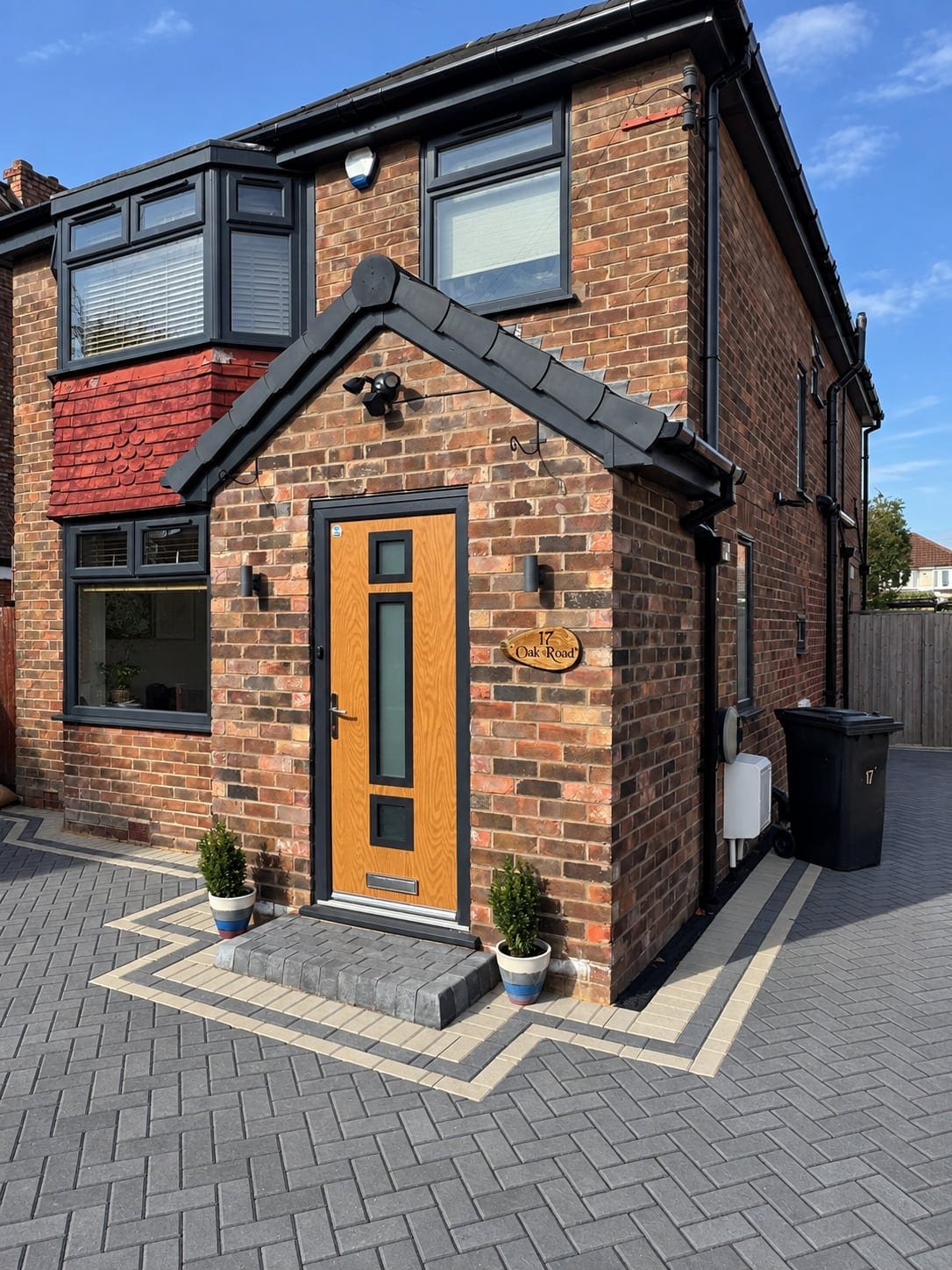 New brick porch with an oak front door