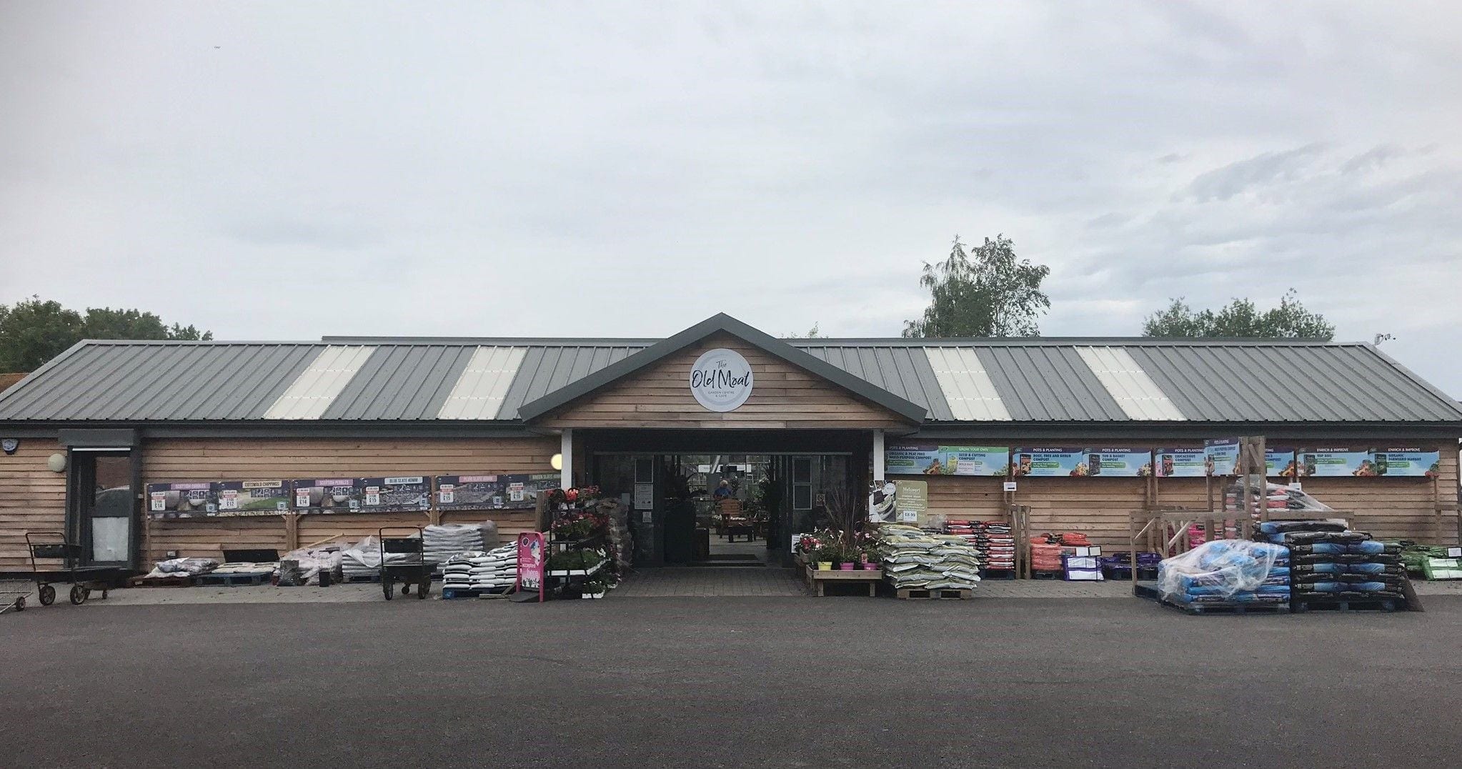 Front of the garden centre with its timber entrance and plant displays