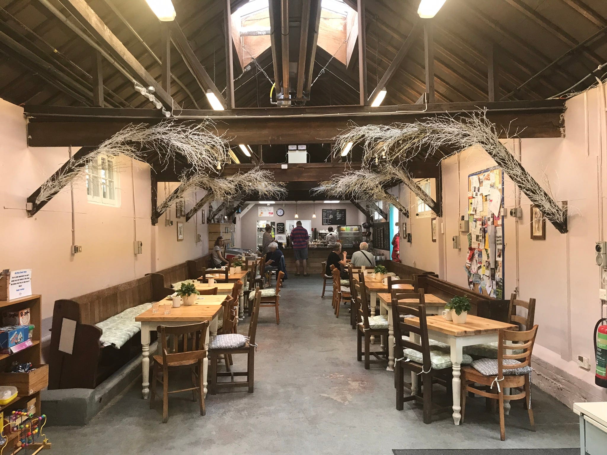 The café seen from the far end, with banquette seating