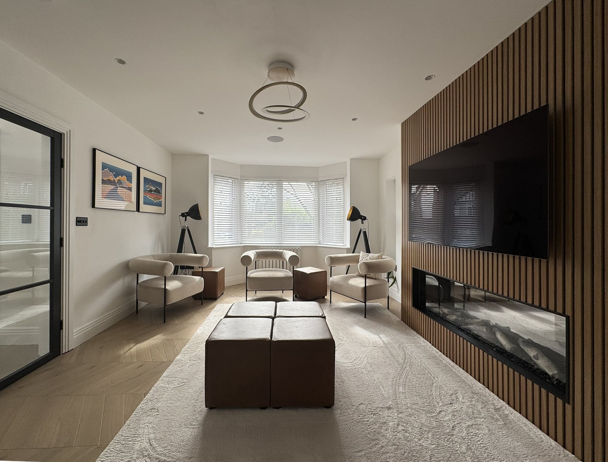 Lounge with a slatted timber feature wall and fireplace