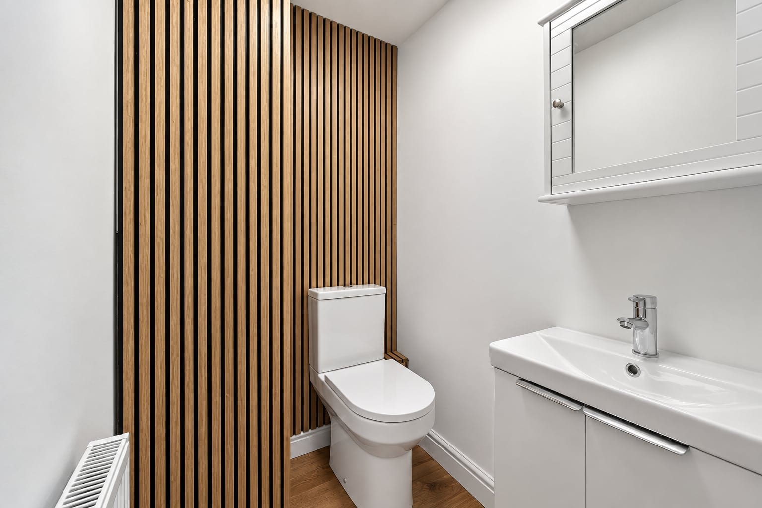 Cloakroom with a slatted timber wall