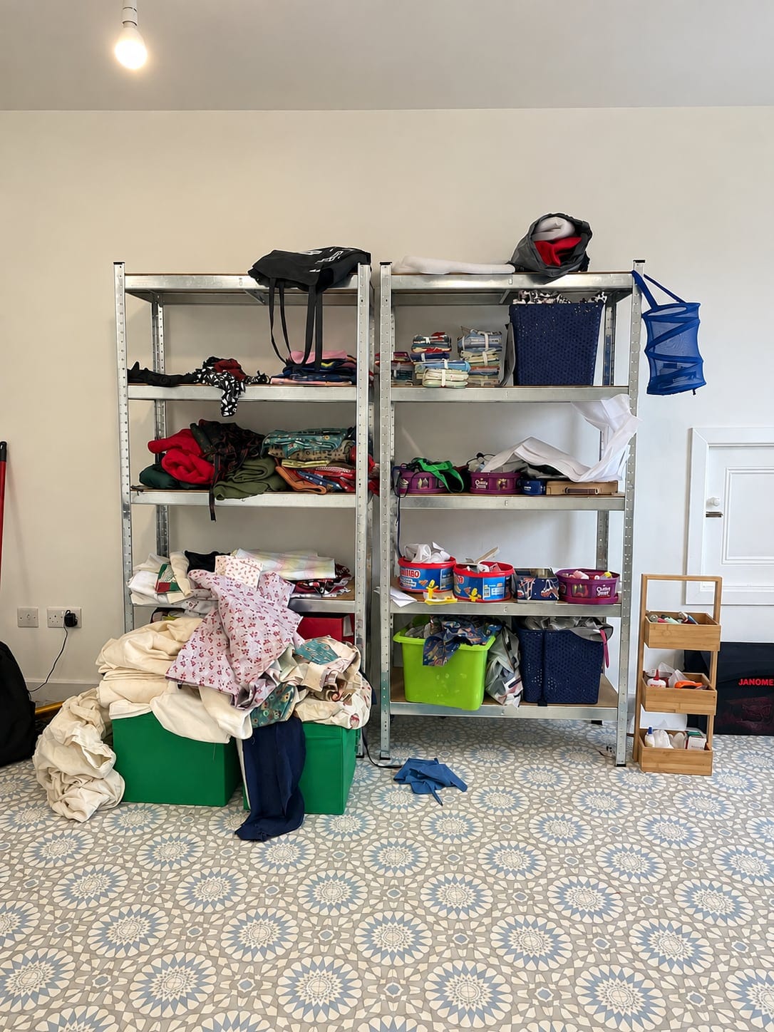 Shelving filled with fabric and sewing materials