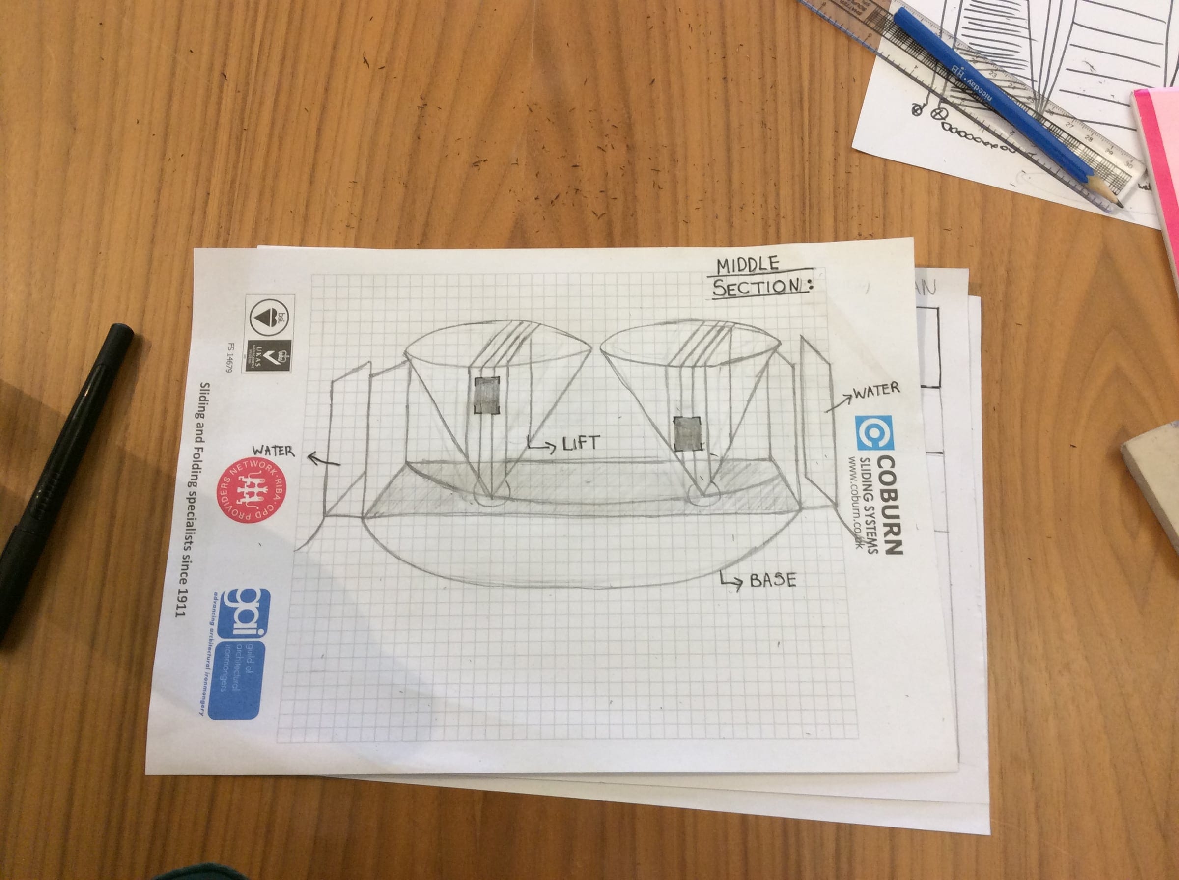 A participant's sketch of a building in section on squared paper