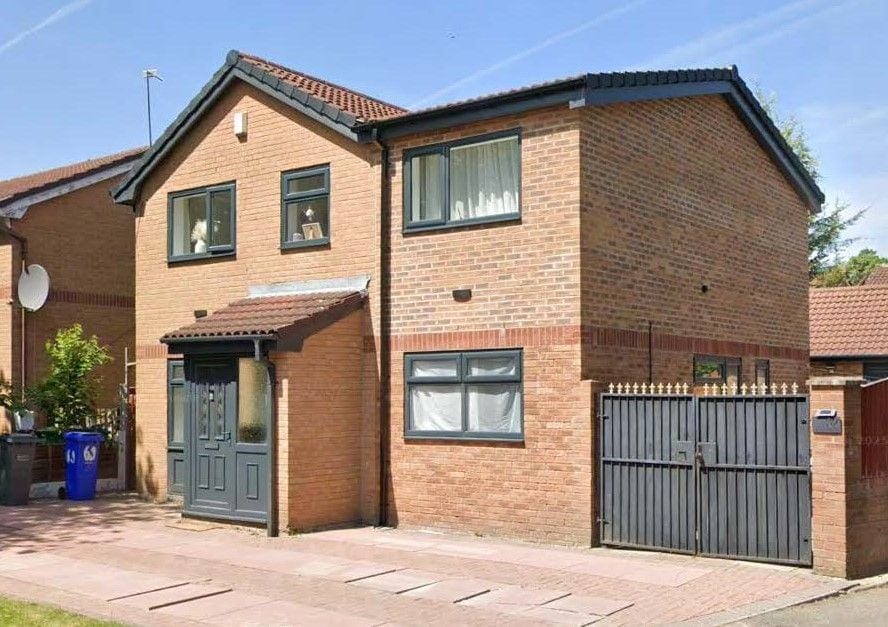 Brick house with a first-floor side extension